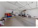 Spacious two-car garage with ample storage and a modern washer and dryer at 9393 New Utrecht St, Las Vegas, NV 89178