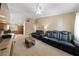 Spacious living room with plush seating and a view of the eat-in kitchen at 9393 New Utrecht St, Las Vegas, NV 89178