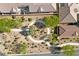 An inviting park with a circular walkway surrounded by green landscaping and trees at 9393 New Utrecht St, Las Vegas, NV 89178