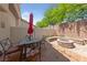 Outdoor patio area with a fire pit, perfect for relaxing and enjoying the outdoors at 9393 New Utrecht St, Las Vegas, NV 89178