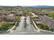 An aerial view of a well-maintained street in a neighborhood with lush landscaping at 9393 New Utrecht St, Las Vegas, NV 89178