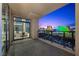 Enjoy the evening lights on the balcony with tile floor, metal railings and city views at 1 Hughes Center Dr # 1901, Las Vegas, NV 89169