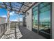 Covered outdoor balcony overlooking city with custom ironwork and tiled floor at 1 Hughes Center Dr # 1901, Las Vegas, NV 89169