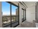 Bathroom overlooking city featuring a balcony with decorative ironwork and a sliding glass door at 1 Hughes Center Dr # 1901, Las Vegas, NV 89169