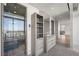 Sleek bathroom featuring modern vanity, storage, and glass-enclosed shower with city view at 1 Hughes Center Dr # 1901, Las Vegas, NV 89169