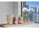 Tranquil bath setting featuring a spa tray with orchids and salts, and a beautiful city view at 1 Hughes Center Dr # 1901, Las Vegas, NV 89169