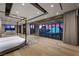 Spacious bedroom with floor-to-ceiling windows offering panoramic city views and modern decor at 1 Hughes Center Dr # 1901, Las Vegas, NV 89169
