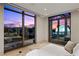 Bright bedroom with expansive windows showcases the city skyline at 1 Hughes Center Dr # 1901, Las Vegas, NV 89169