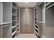 Walk in closet with custom shelving at 1 Hughes Center Dr # 1901, Las Vegas, NV 89169