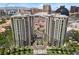 Striking aerial shot of luxury condos with lush landscaping and vibrant city backdrop at 1 Hughes Center Dr # 1901, Las Vegas, NV 89169