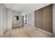 Open hallway featuring decorative wood paneling, hardwood floors and recessed lighting at 1 Hughes Center Dr # 1901, Las Vegas, NV 89169