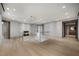 Open hallway with hardwood floors and glass railing on staircase at 1 Hughes Center Dr # 1901, Las Vegas, NV 89169