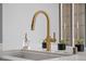 Modern kitchen with a stainless steel sink, stylish golden faucet, and an elegant stone countertop with room for decor at 1 Hughes Center Dr # 1901, Las Vegas, NV 89169
