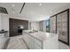 Sleek kitchen with an island featuring stone countertops and modern appliances, complete with custom cabinets at 1 Hughes Center Dr # 1901, Las Vegas, NV 89169