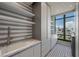 Bright laundry room with a sink, modern appliances and city views through a large window at 1 Hughes Center Dr # 1901, Las Vegas, NV 89169