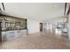 Spacious living room featuring tile floors, modern bar area and large windows at 1 Hughes Center Dr # 1901, Las Vegas, NV 89169