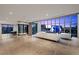 Spacious living room with fireplace and floor-to-ceiling windows with city views, offering both comfort and luxury at 1 Hughes Center Dr # 1901, Las Vegas, NV 89169