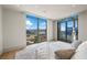 Bright living room with city views through large windows and a comfortable sofa at 1 Hughes Center Dr # 1901, Las Vegas, NV 89169