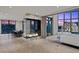Open-concept living area with glass fireplace and city views, showcasing a sleek and modern design at 1 Hughes Center Dr # 1901, Las Vegas, NV 89169