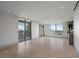 Bright living room with floor to ceiling windows, hardwood floors, and city views at 1 Hughes Center Dr # 1901, Las Vegas, NV 89169