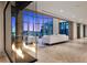 Open-concept living space with floor-to-ceiling windows and views of the Las Vegas skyline at 1 Hughes Center Dr # 1901, Las Vegas, NV 89169