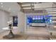 Open-concept living room with staircase, white sofas, and city view, creating a modern and elegant space at 1 Hughes Center Dr # 1901, Las Vegas, NV 89169