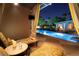 Inviting pool with cabana, lounge chairs, and city views at night at 1 Hughes Center Dr # 1901, Las Vegas, NV 89169