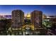 Stunning nighttime aerial view of the luxury high rise condos with city and High Roller Observation Wheel views at 1 Hughes Center Dr # 308, Las Vegas, NV 89169