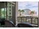 Comfortable outdoor seating with an elegant wrought iron balcony overlooking the city skyline at 1 Hughes Center Dr # 308, Las Vegas, NV 89169