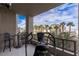 Enjoy city views from this relaxing balcony with comfortable seating and exercise equipment at 1 Hughes Center Dr # 308, Las Vegas, NV 89169