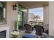 Inviting outdoor balcony featuring comfortable seating and city views, enhancing the home's appeal at 1 Hughes Center Dr # 308, Las Vegas, NV 89169
