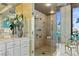 Contemporary bathroom showcasing a glass shower, gold fixtures, and natural light at 1 Hughes Center Dr # 308, Las Vegas, NV 89169