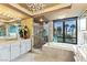 Elegant bathroom with a glass shower, soaking tub, and stunning city views at 1 Hughes Center Dr # 308, Las Vegas, NV 89169
