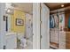 Bright bathroom leading to closet boasts walk-in shower, vanity, and modern fixtures at 1 Hughes Center Dr # 308, Las Vegas, NV 89169