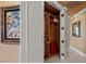Open closet with built-in wooden shelving, hanging rods, and ample storage space on a neutral wall at 1 Hughes Center Dr # 308, Las Vegas, NV 89169