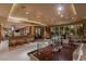 Open dining and living area with sleek furnishings, bar seating, and views of the Las Vegas skyline at 1 Hughes Center Dr # 308, Las Vegas, NV 89169
