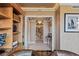 Stunning hallway with chandeliers and artwork leads to other luxurious rooms in the home at 1 Hughes Center Dr # 308, Las Vegas, NV 89169