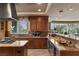 Gourmet kitchen featuring custom cabinetry, granite countertops, and high-end appliances for culinary enthusiasts at 1 Hughes Center Dr # 308, Las Vegas, NV 89169