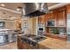 Modern kitchen with stainless steel appliances, custom cabinetry, and a functional island for cooking at 1 Hughes Center Dr # 308, Las Vegas, NV 89169