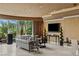 Elegant living room featuring a plush sofa, modern lighting, and a large window view at 1 Hughes Center Dr # 308, Las Vegas, NV 89169