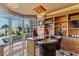 This office features custom shelving, a desk space and cityscape views at 1 Hughes Center Dr # 308, Las Vegas, NV 89169