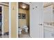 Powder room featuring a toilet and bidet with marble floors and decorative fixtures at 1 Hughes Center Dr # 308, Las Vegas, NV 89169