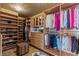 Spacious walk-in closet with custom wood shelving and ample storage space at 1 Hughes Center Dr # 308, Las Vegas, NV 89169