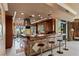 Gourmet kitchen with a bar offering seating, a built-in range hood, and a balcony view at 1 Hughes Center Dr # 308, Las Vegas, NV 89169