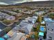 View of residences showcasing backyard pools, desert landscaping, and community layout at 10 Sugarberry Ln, Las Vegas, NV 89135