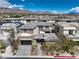 Stunning aerial view showcasing the modern home, manicured landscaping, and the picturesque neighborhood at 10 Sugarberry Ln, Las Vegas, NV 89135