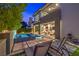 Backyard oasis with a modern pool, stylish lounge chairs, and an elegant outdoor living space at 10 Sugarberry Ln, Las Vegas, NV 89135