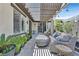 Back patio area with pergola, landscaped yard, and outdoor seating at 10484 Rose Park Ave, Las Vegas, NV 89135