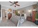Charming bedroom features gray walls, wood-look floors, and a ceiling fan at 10484 Rose Park Ave, Las Vegas, NV 89135