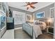 Cozy bedroom with a ceiling fan, shutters on the windows, and neutral paint at 10484 Rose Park Ave, Las Vegas, NV 89135